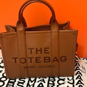 13 inch x 10.24 inch. Brown cow leather bag.